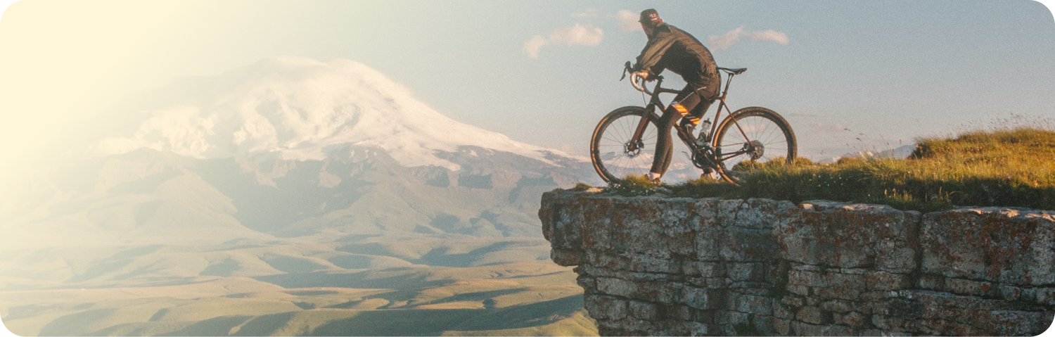 Biker on a cliff with a view