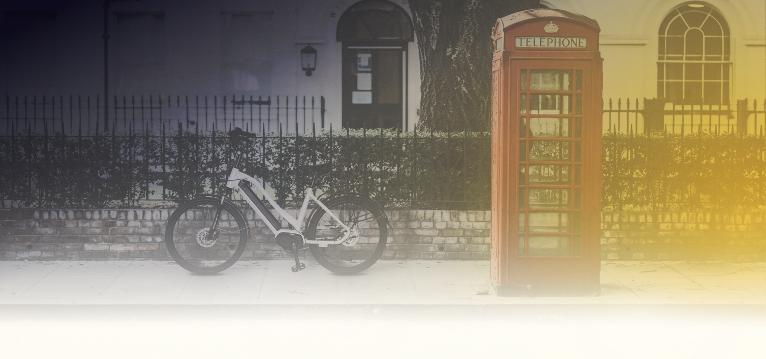 Bike on the road with telephone booth