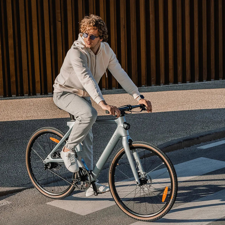 Fiido Air lightweight carbon e-bike being ridden through the city