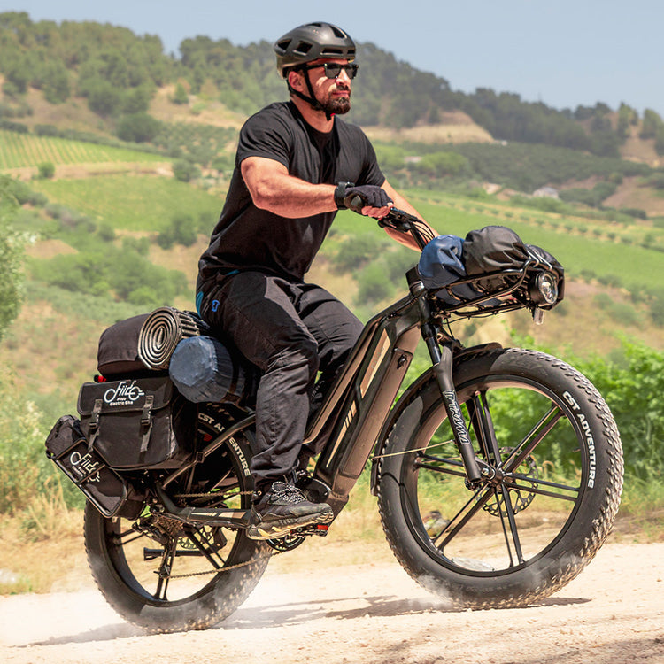 Rider using a Fiido Titan fat tyre electric bike off road