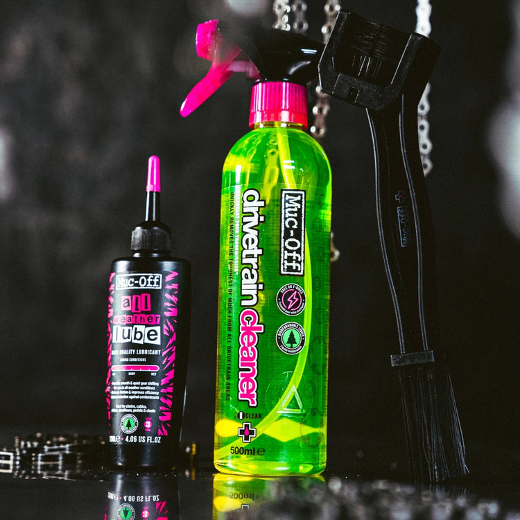 Muc-Off Bicycle Chain Care Kit contents including drivetrain cleaner, chain brush and all-weather lube